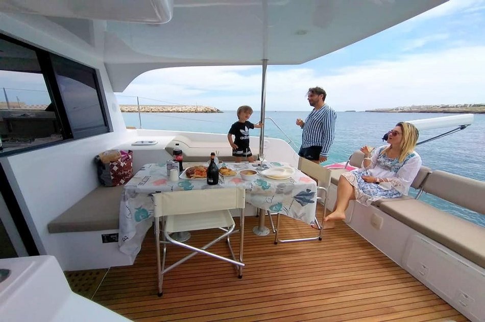 Catamaran sail tour to the caves of Polignano a Mare